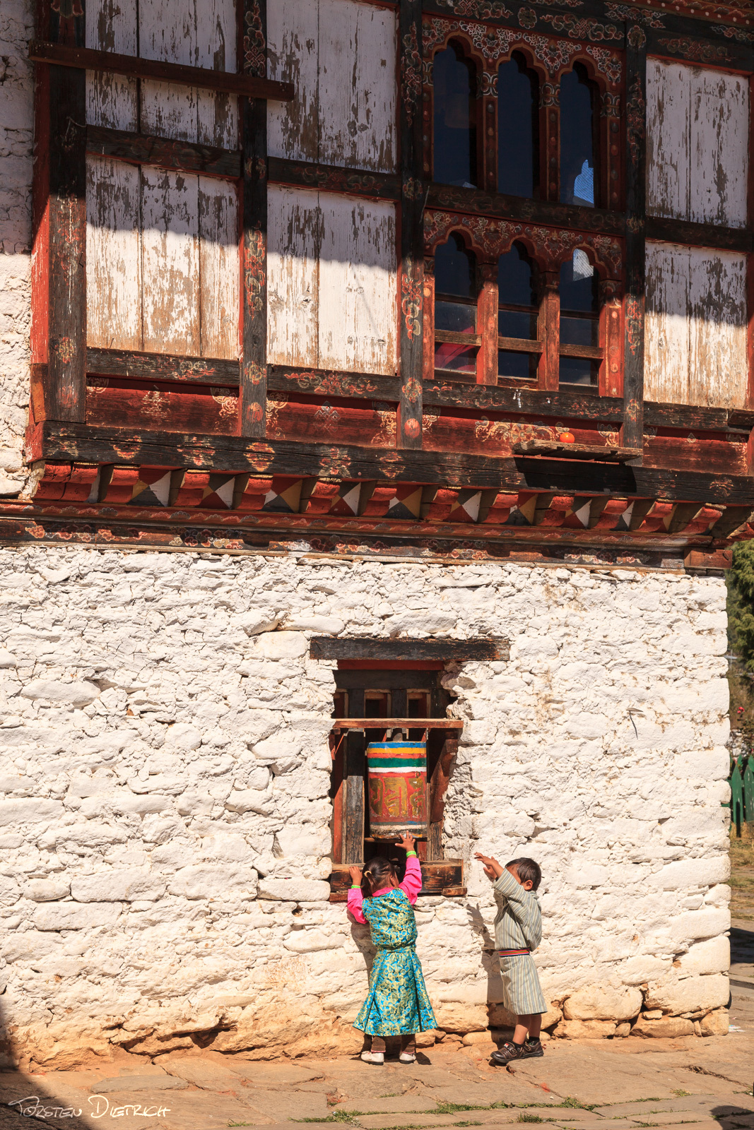 Kids and a prayer wheel
